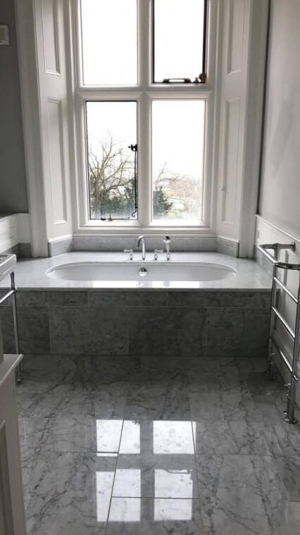 Modern Bathroom with Bath fitted to curvature of the window Modern Bathroom with Bath fitted to curvature of the window